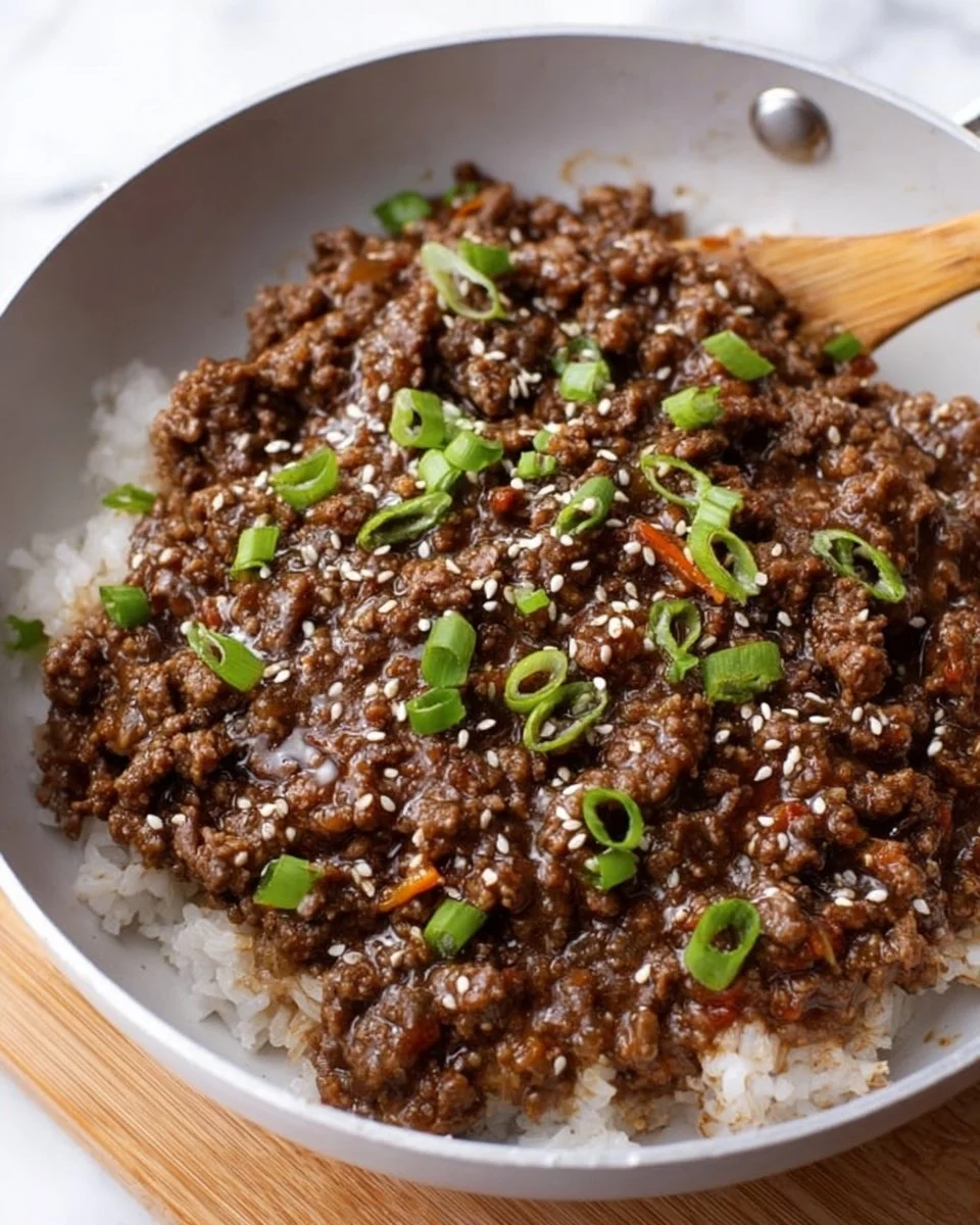Delicious Korean Beef Bowl topped with green onions and sesame seeds
